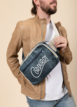 man wearing corduroy branded sling bag