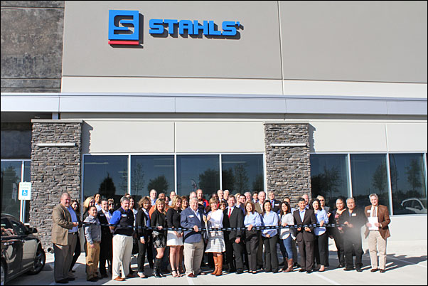 Stahls staff and guests join Executive Chairman of the Board Ted Stahl and his wife, Mary, for a ribbon cutting to open the supplier's Texas facility.