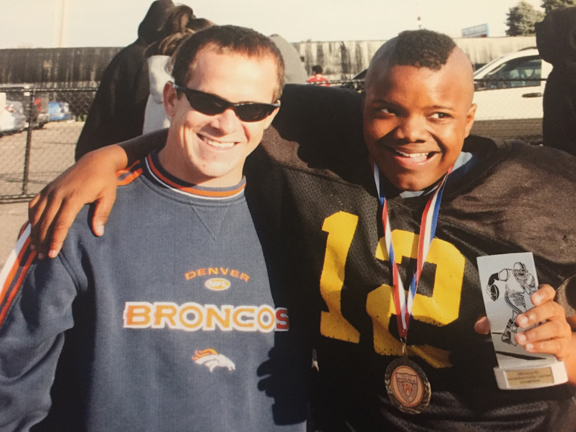 Kaspari (left) and his mentee, Noah Jones, then a sixth-grade football player.