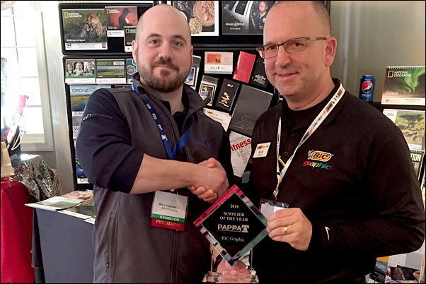 BIC's Kyle Johnson accepts the supplier's Supplier of the Year award from PAPPA Board President Mike Valentini, Jr.