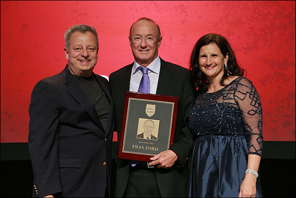 Fran Ford (center), receives a plaque marking his induction into the Proforma Hall of Fame, with Founder Greg Muzzillo and CEO Vera Muzzillo