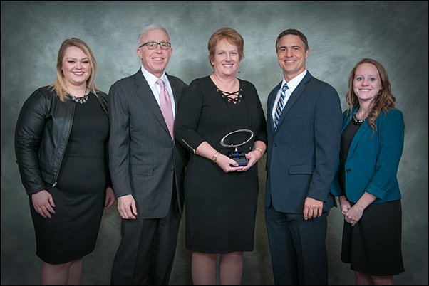 Pattry Ceranski, Gemline major accounts representative (center), stands with her Supplier Representative Of The Year award and (from left) Natalie Ehredt, supplier relations, HALO; Marc Simon, CEO, HALO; Terry McGuire, senior vice president of marketing and supplier relations, HALO; and Amanda Schreck, supplier relations, HALO. 