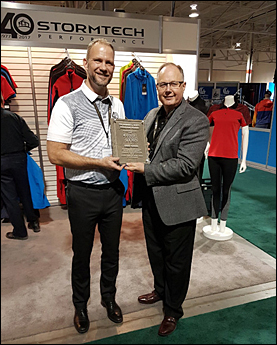 Chris Turner (left) receives the Robert L. Scott Memorial Award from Wally Richards on behalf of Imprint Canada.
