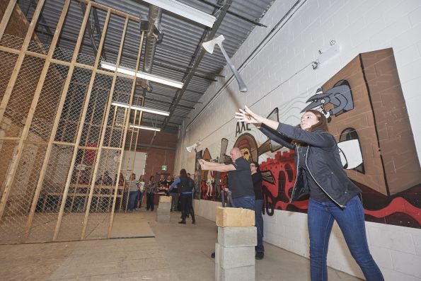 Attendees take the opportunity to unwind at the National Convention’s axe-throwing party, sponsored by the PPPC Board of Directors and BIC Graphic.