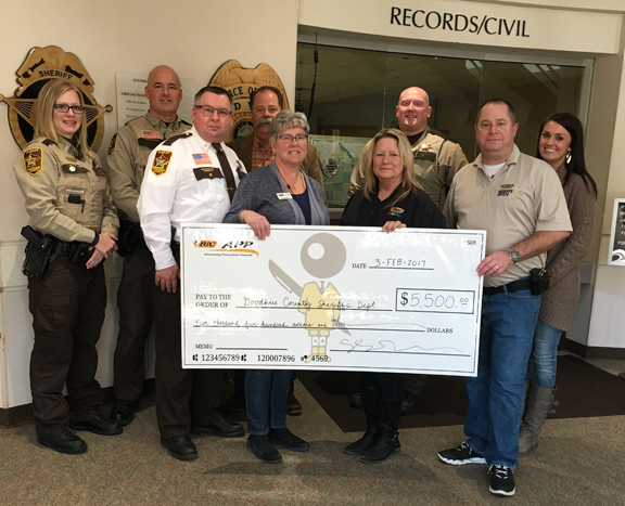 Deb Fleming, Linda Huppert (holding the check) and Cassie Otto of BIC Graphic Red Wing visited the Goodhue County Sheriff’s Office to present them with the donation on February 2.