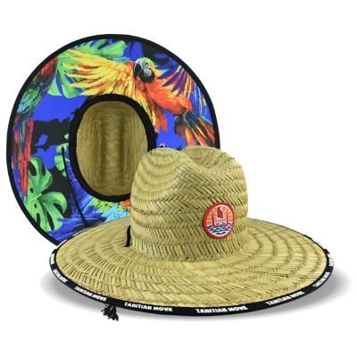 straw hat with custom patch on the crown and colorful print under the brim